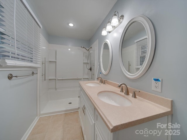 bathroom featuring a shower, vanity, and tile patterned floors