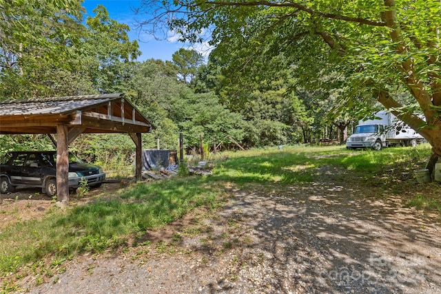 view of yard with a carport