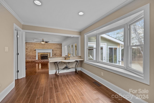 interior space with crown molding and dark hardwood / wood-style floors