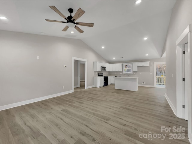 unfurnished living room featuring ceiling fan, high vaulted ceiling, and light hardwood / wood-style flooring