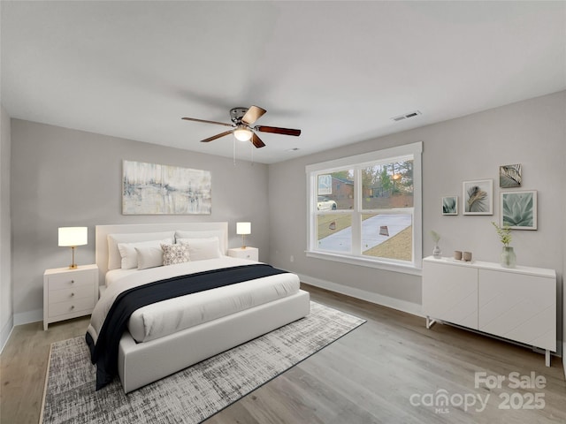 bedroom featuring ceiling fan and hardwood / wood-style floors