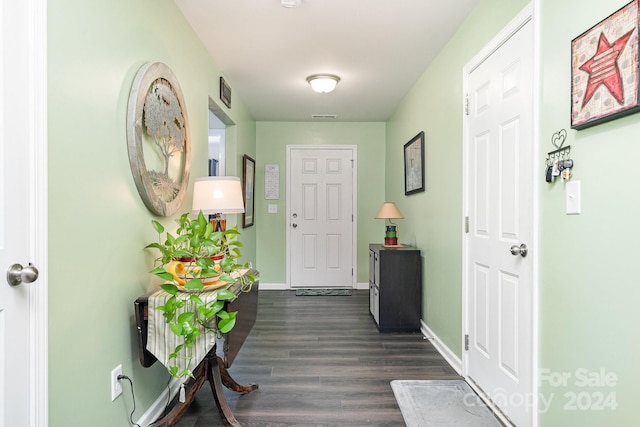 corridor with dark hardwood / wood-style floors