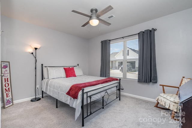 bedroom with ceiling fan and light colored carpet