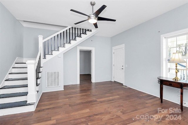 interior space featuring ceiling fan and dark wood-type flooring