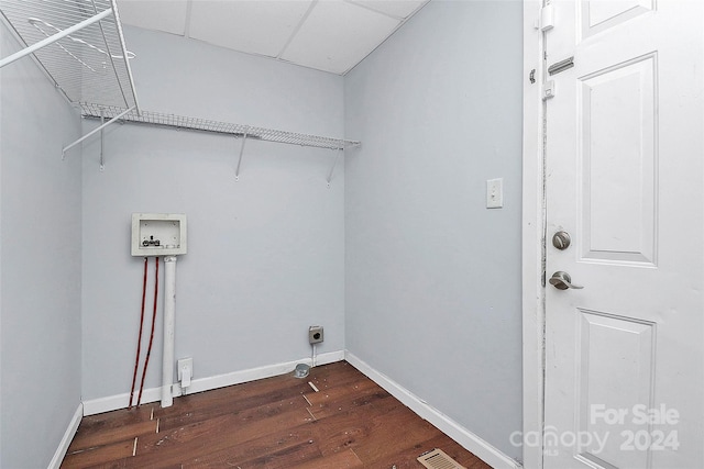 laundry room featuring dark hardwood / wood-style flooring, hookup for a washing machine, and hookup for an electric dryer