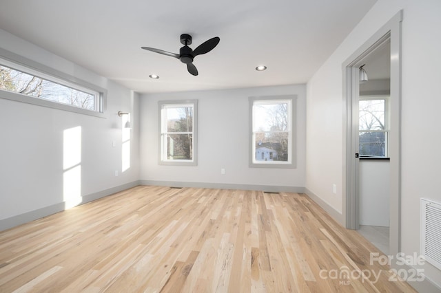 interior space with ceiling fan and light hardwood / wood-style flooring