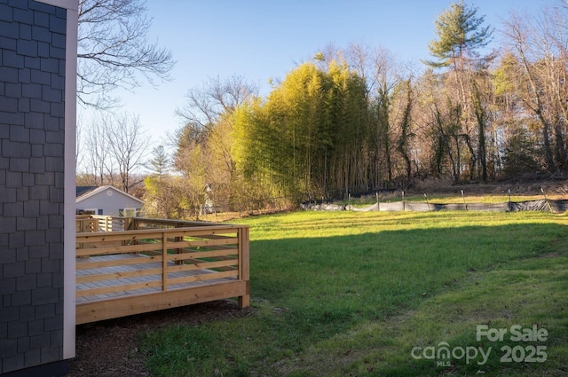 view of yard with a deck