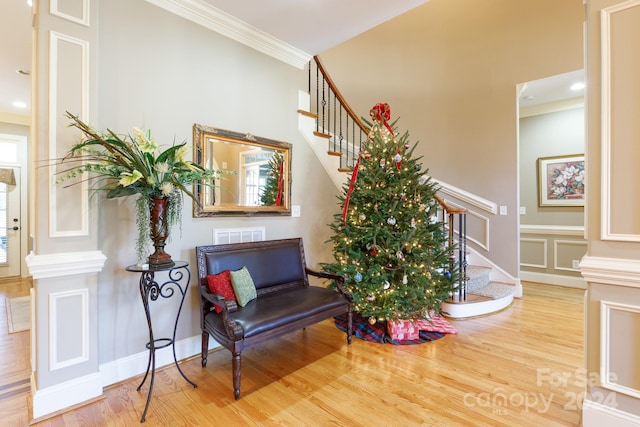 interior space featuring crown molding and wood-type flooring