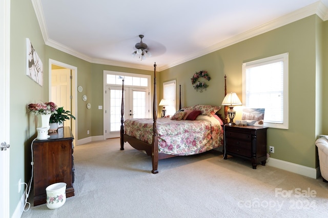 bedroom featuring ceiling fan, crown molding, light carpet, and french doors