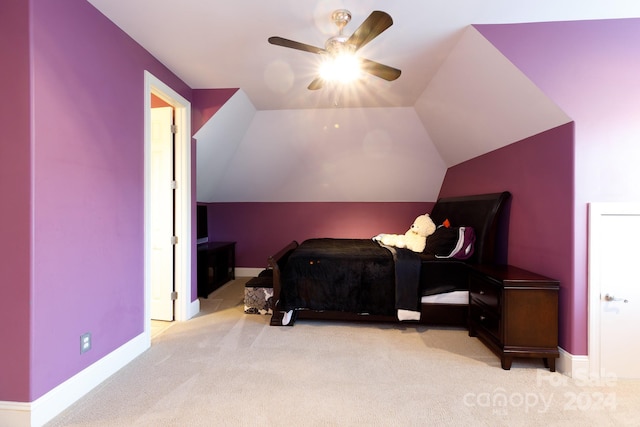 bedroom featuring ceiling fan, light colored carpet, and vaulted ceiling