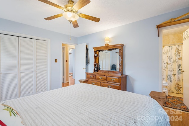 bedroom featuring hardwood / wood-style floors, ceiling fan, a textured ceiling, and a closet