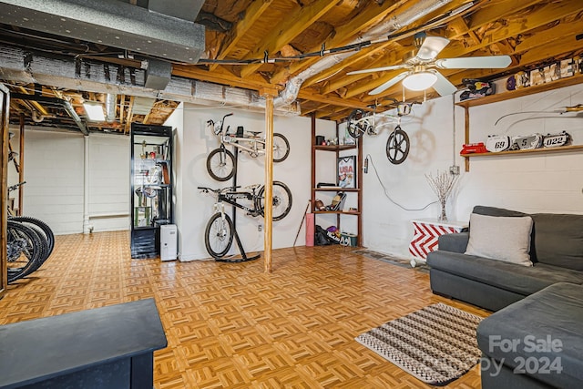 living room with ceiling fan and light parquet flooring