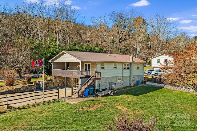 back of property with a lawn and central air condition unit