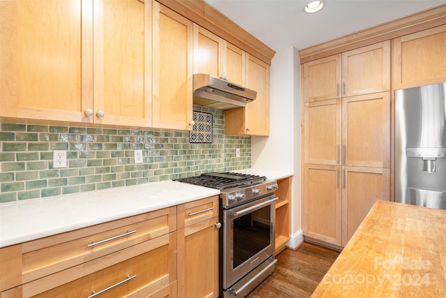 kitchen featuring wooden counters, decorative backsplash, stainless steel appliances, dark wood-type flooring, and light brown cabinets