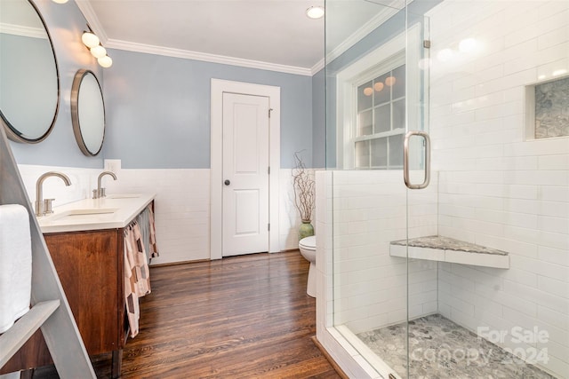 bathroom with crown molding, toilet, tile walls, and hardwood / wood-style flooring