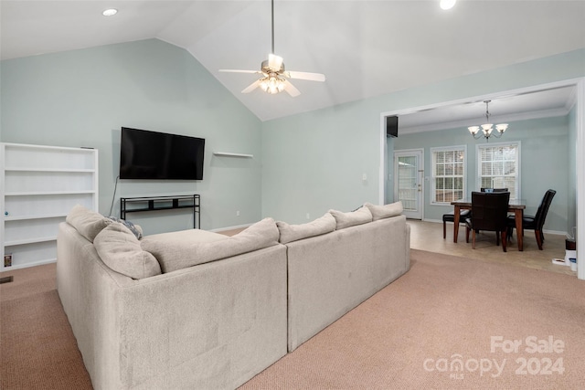 carpeted living room featuring ceiling fan with notable chandelier, crown molding, and lofted ceiling