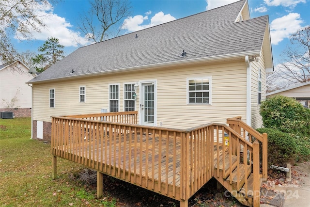 back of house featuring a lawn, a wooden deck, and cooling unit