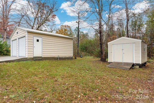 view of outbuilding featuring a yard