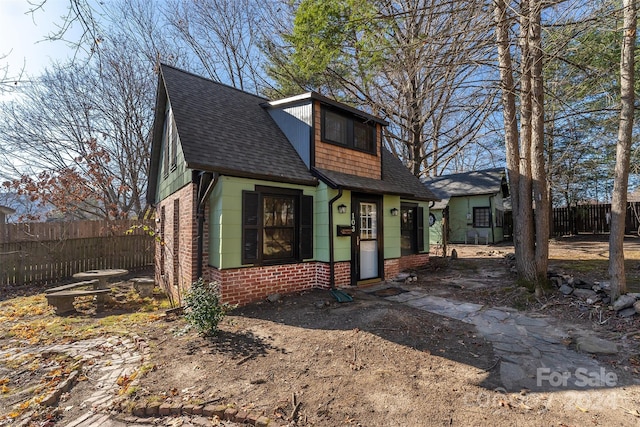 103 Pine St, Black Mountain, NC 28711 - view of front of house featuring roof with shingles and brick siding