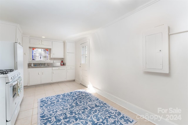 103 Pine St, Black Mountain, NC 28711 - kitchen with electric panel, gas range gas stove, light tile patterned flooring, white cabinets, and ornamental molding