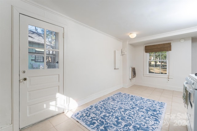 tiled entrance foyer with heating unit and crown molding