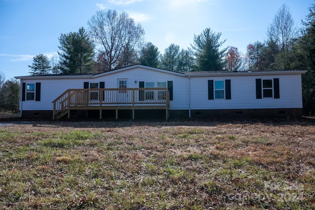 view of front of house featuring a wooden deck