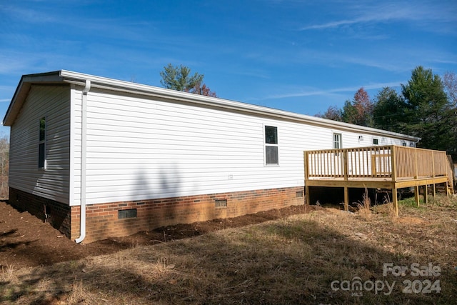 view of side of property with a deck