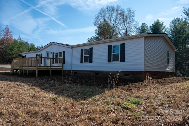 exterior space featuring a wooden deck