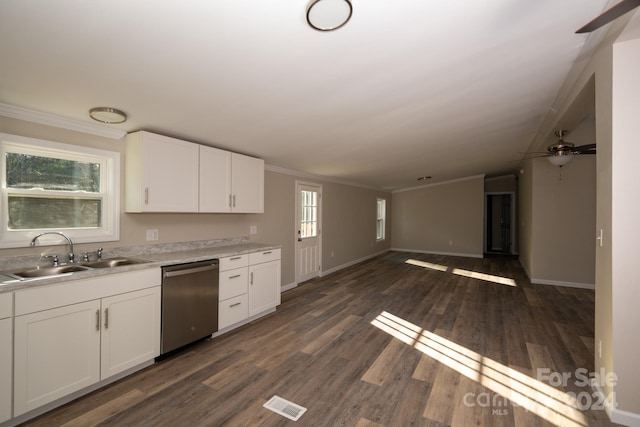 kitchen featuring dishwasher, sink, dark hardwood / wood-style floors, plenty of natural light, and white cabinetry