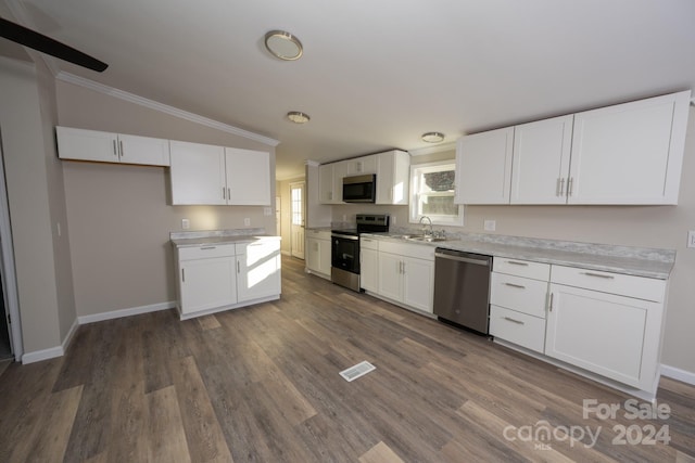 kitchen with white cabinets, sink, crown molding, dark hardwood / wood-style floors, and appliances with stainless steel finishes