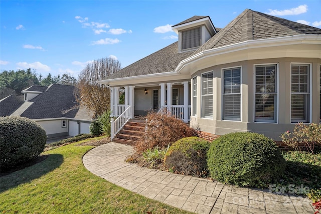 exterior space with a lawn and a porch