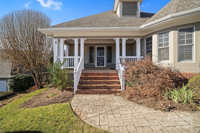 doorway to property featuring covered porch