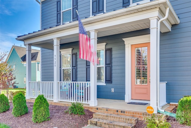 doorway to property with covered porch