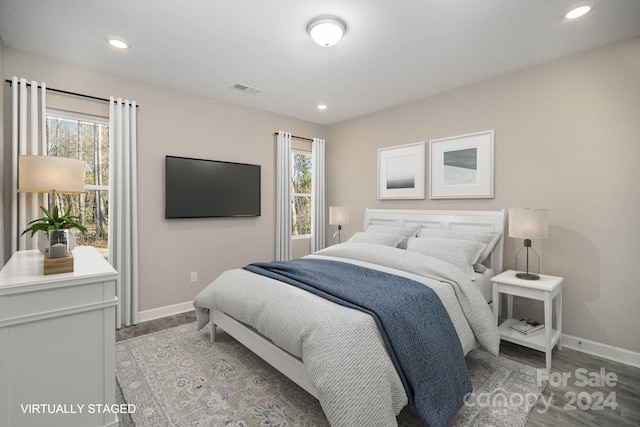 bedroom with hardwood / wood-style floors