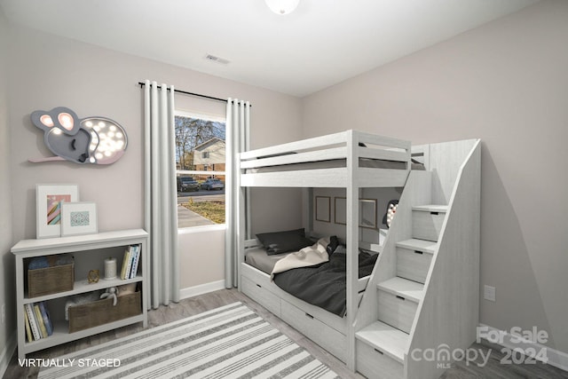 bedroom with light wood-type flooring