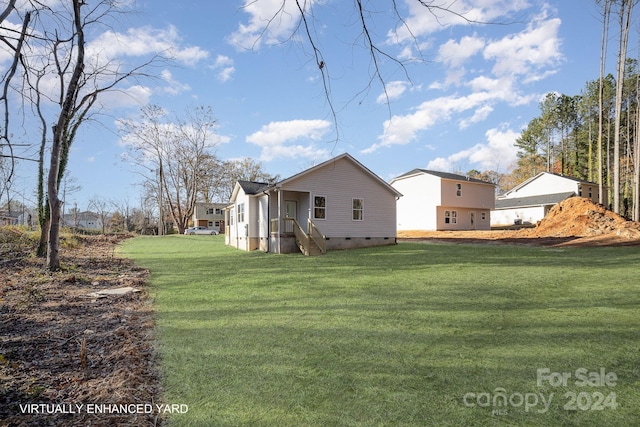 back of property with a lawn