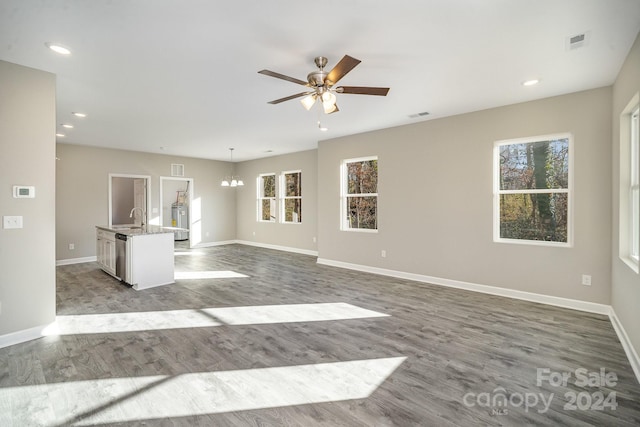 unfurnished living room with hardwood / wood-style floors and a healthy amount of sunlight