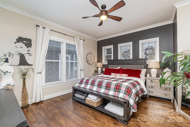 bedroom featuring ornamental molding, dark wood-type flooring, and ceiling fan