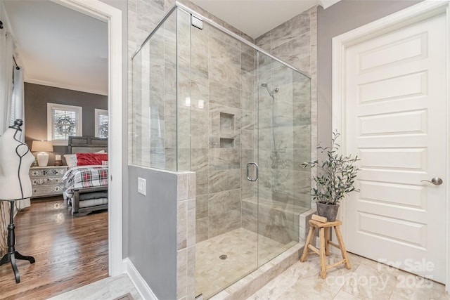 bathroom featuring a shower with shower door