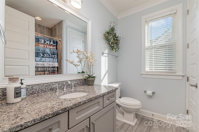 bathroom featuring toilet, crown molding, vanity, curtained shower, and hardwood / wood-style floors