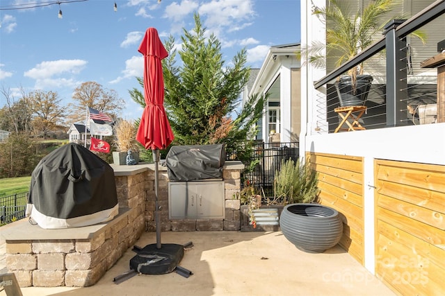 view of patio / terrace featuring area for grilling and a grill