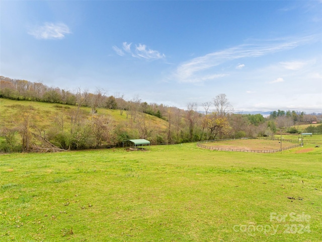 view of yard with a rural view