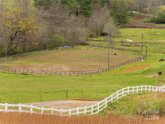 view of yard with a rural view