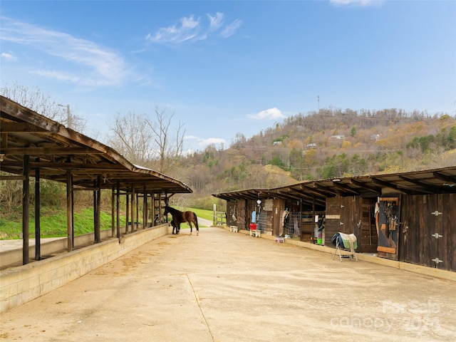 view of home's community featuring an outbuilding and a rural view