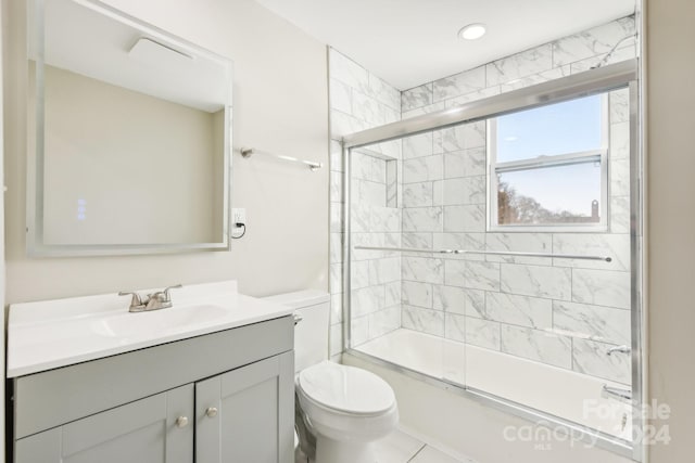 full bathroom with tile patterned flooring, vanity, toilet, and shower / bath combination with glass door