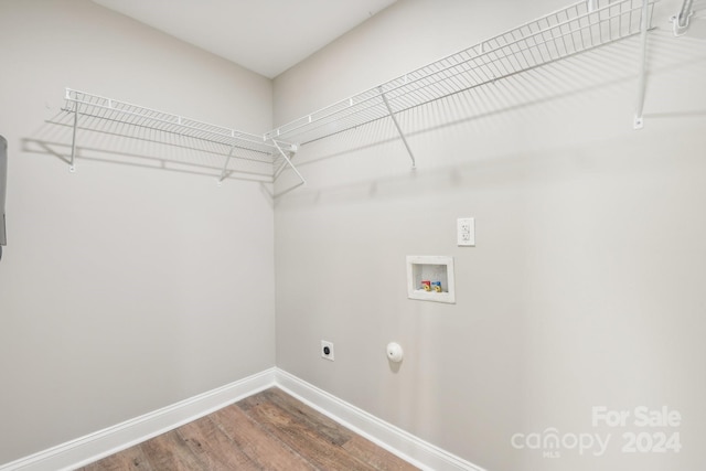 washroom featuring electric dryer hookup, hookup for a gas dryer, wood-type flooring, and hookup for a washing machine