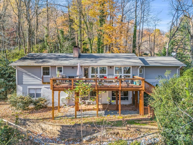 rear view of property with a deck