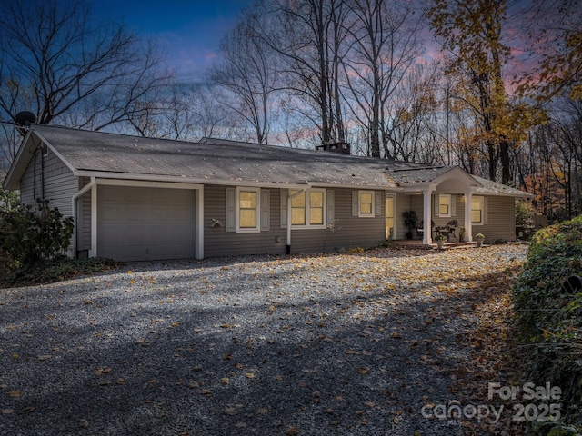 single story home featuring a garage