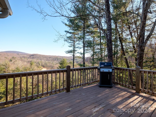 wooden deck featuring area for grilling