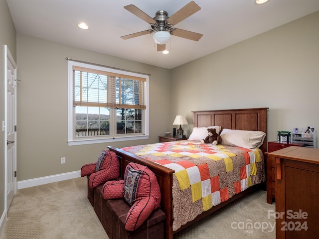 carpeted bedroom with ceiling fan